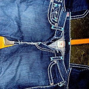 True Religion size 31 skinny jeans with turquoise accent stitching